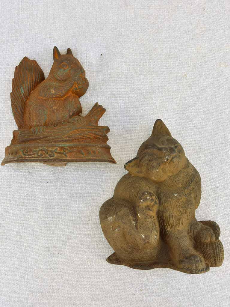 Two vintage French cast iron doorstops - cat and squirrel