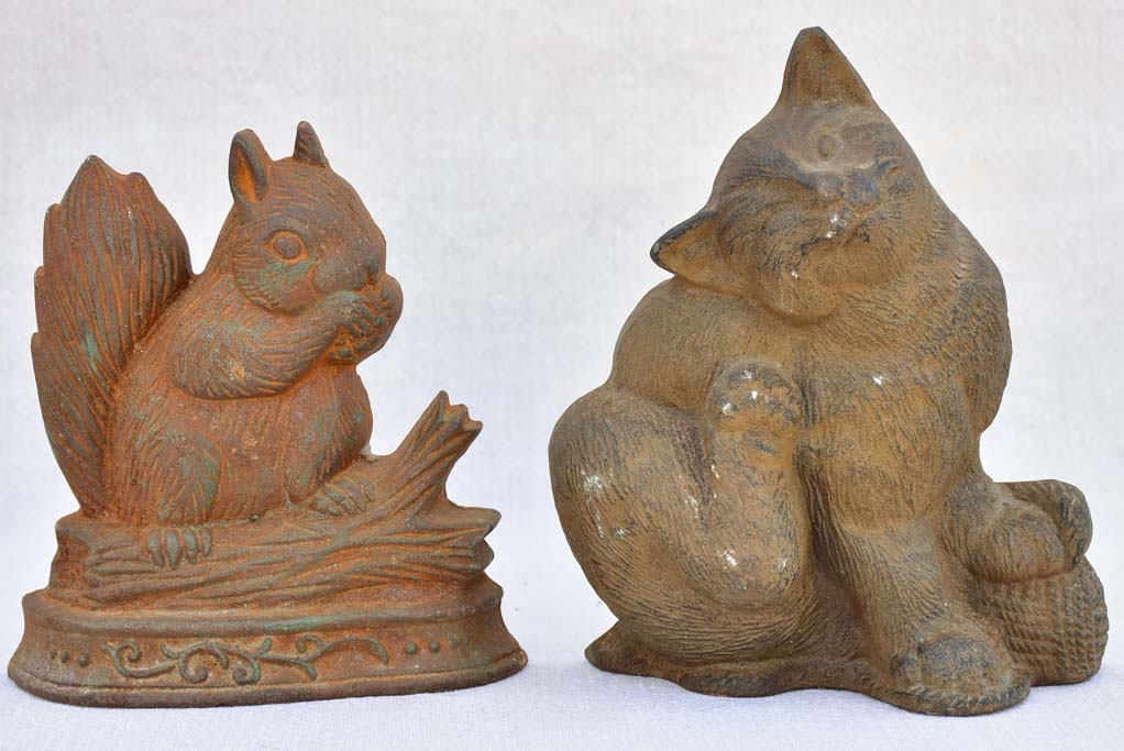 Two vintage French cast iron doorstops - cat and squirrel