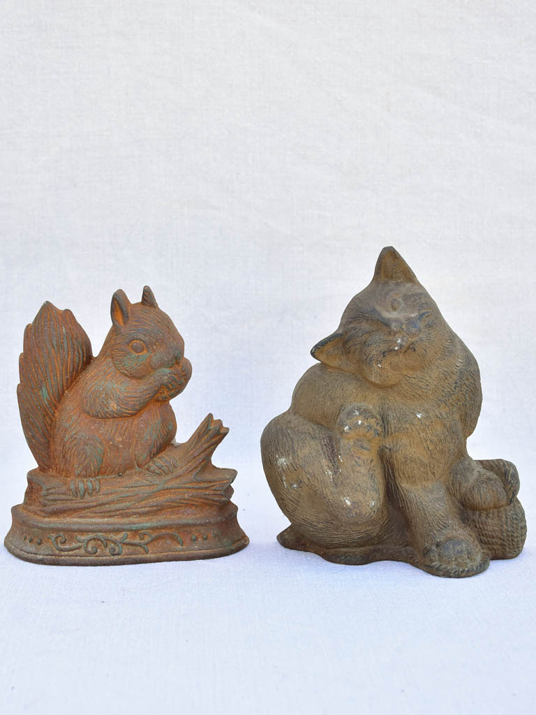 Two vintage French cast iron doorstops - cat and squirrel