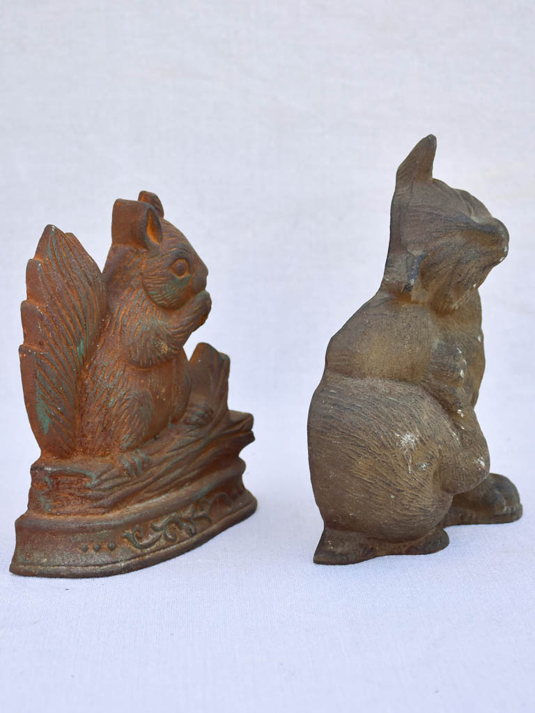 Two vintage French cast iron doorstops - cat and squirrel