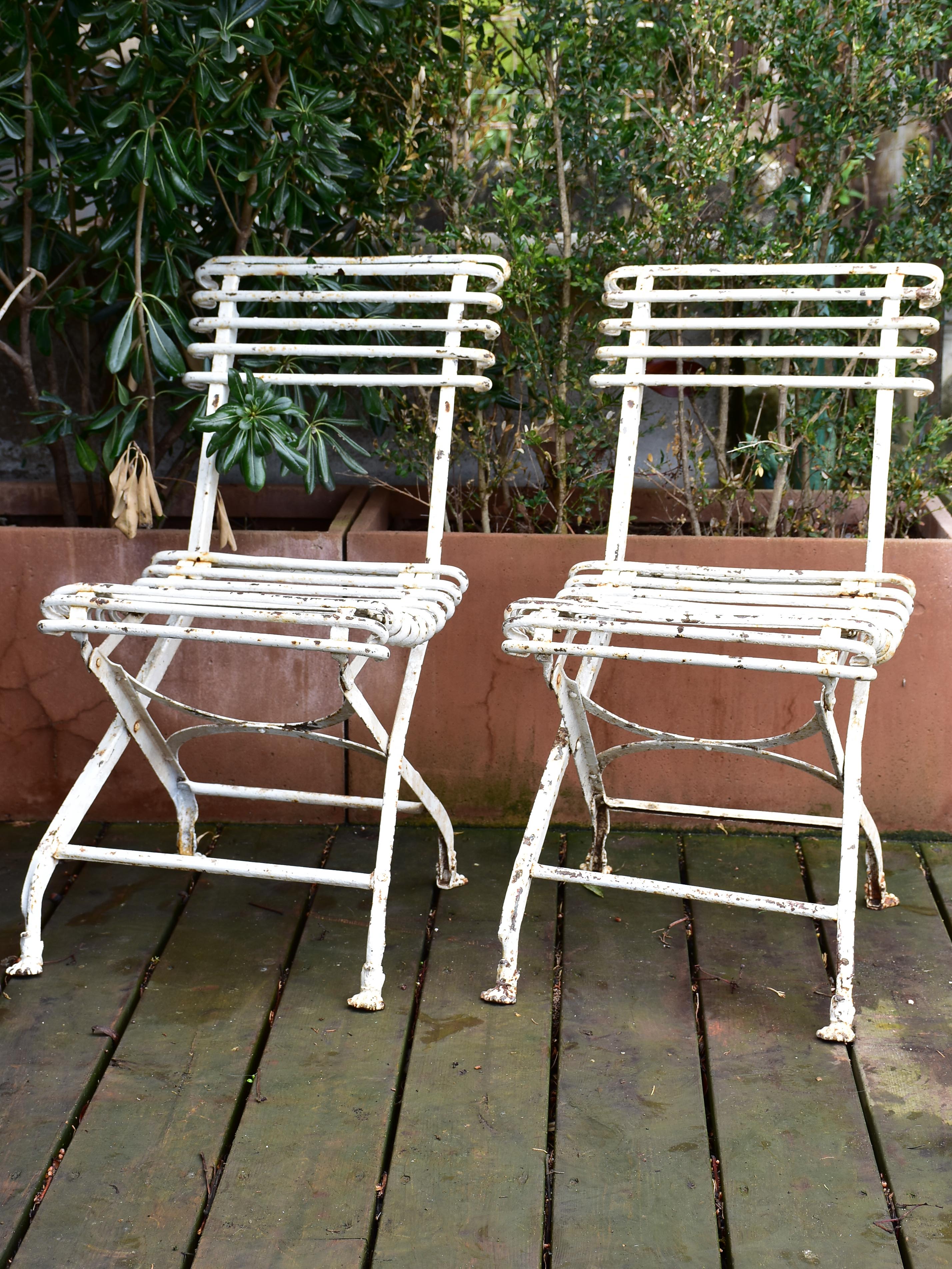 Pair of antique French folding Arras garden chairs with claw feet