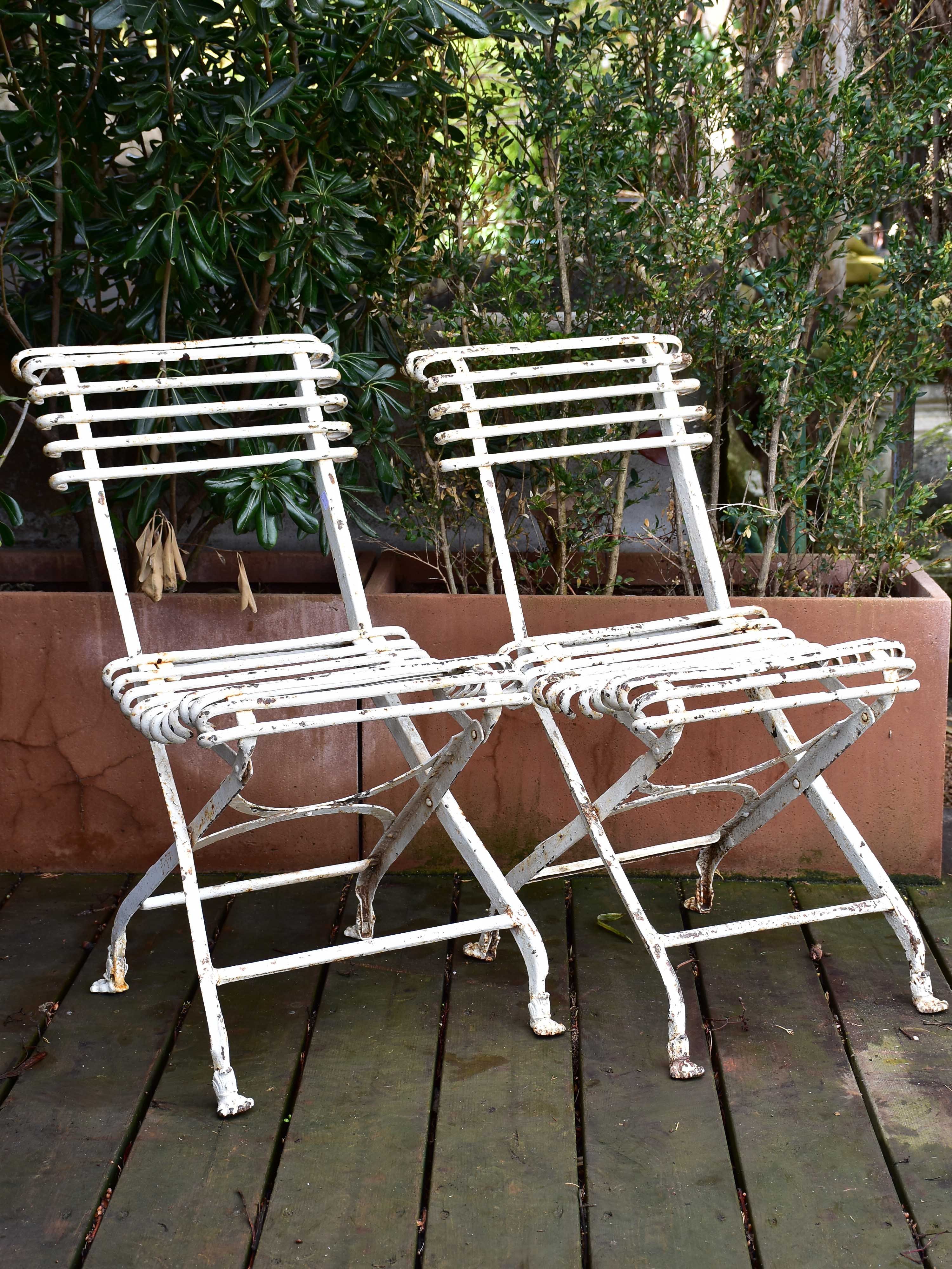 Pair of antique French folding Arras garden chairs with claw feet