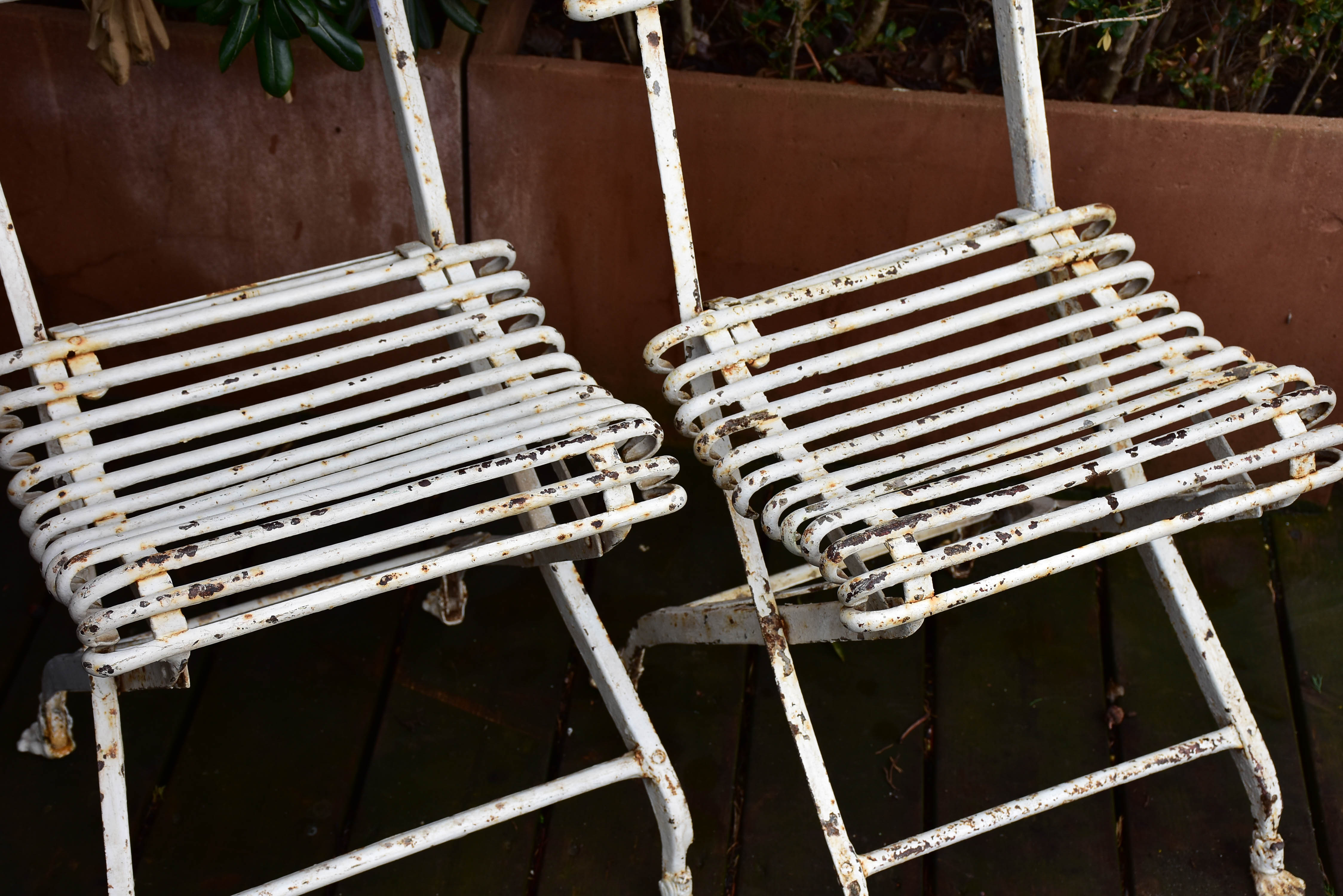 Pair of antique French folding Arras garden chairs with claw feet