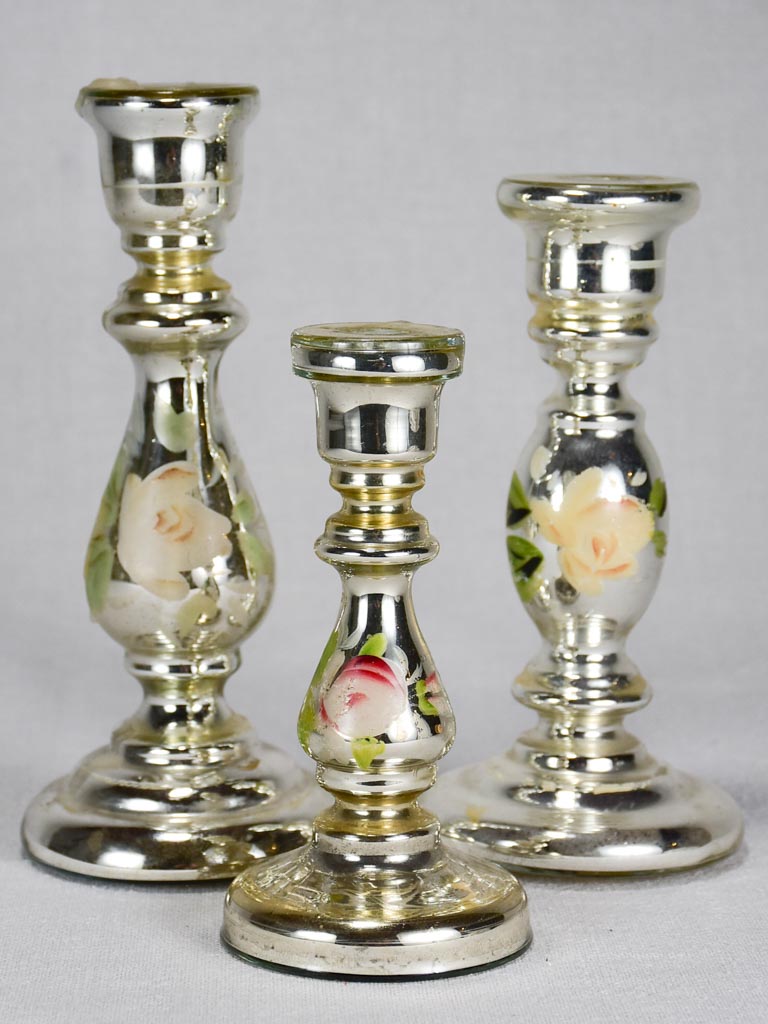 Three mercury glass candlesticks with hand-painted flowers