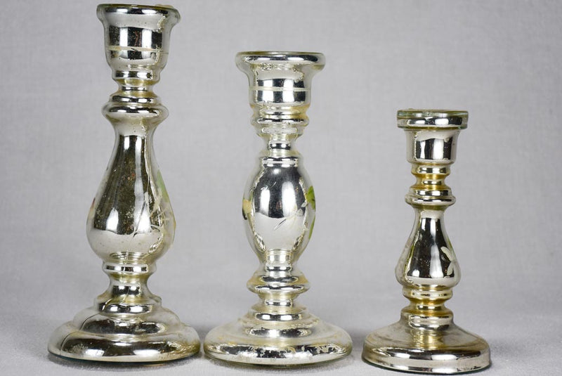 Three mercury glass candlesticks with hand-painted flowers