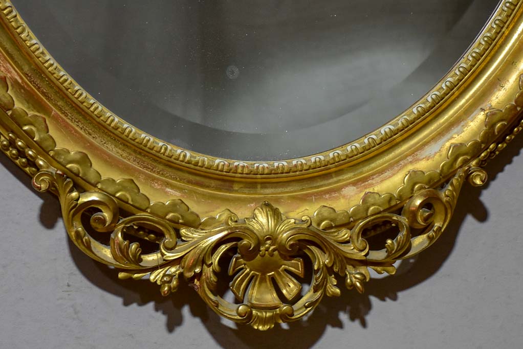 Very large oval French mirror with gilded frame and crest 32¼" x 48½"