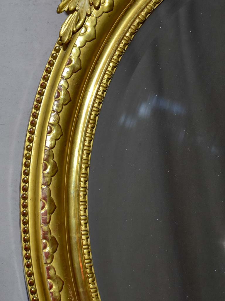 Very large oval French mirror with gilded frame and crest 32¼" x 48½"