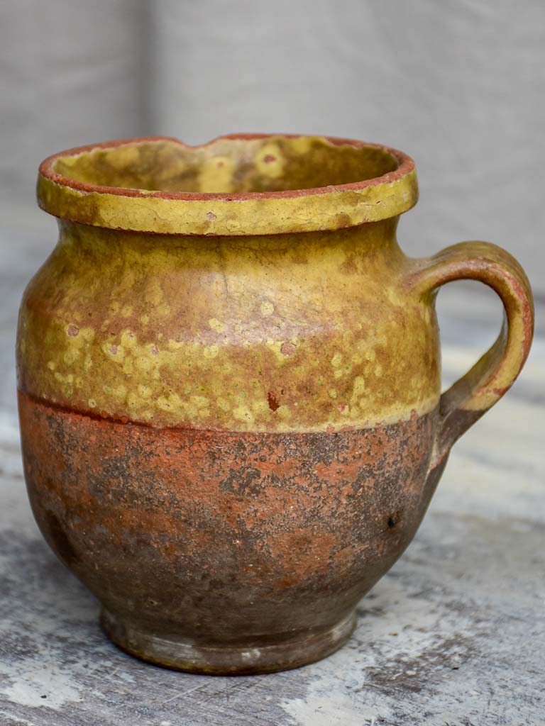 Antique French cup with yellow glaze