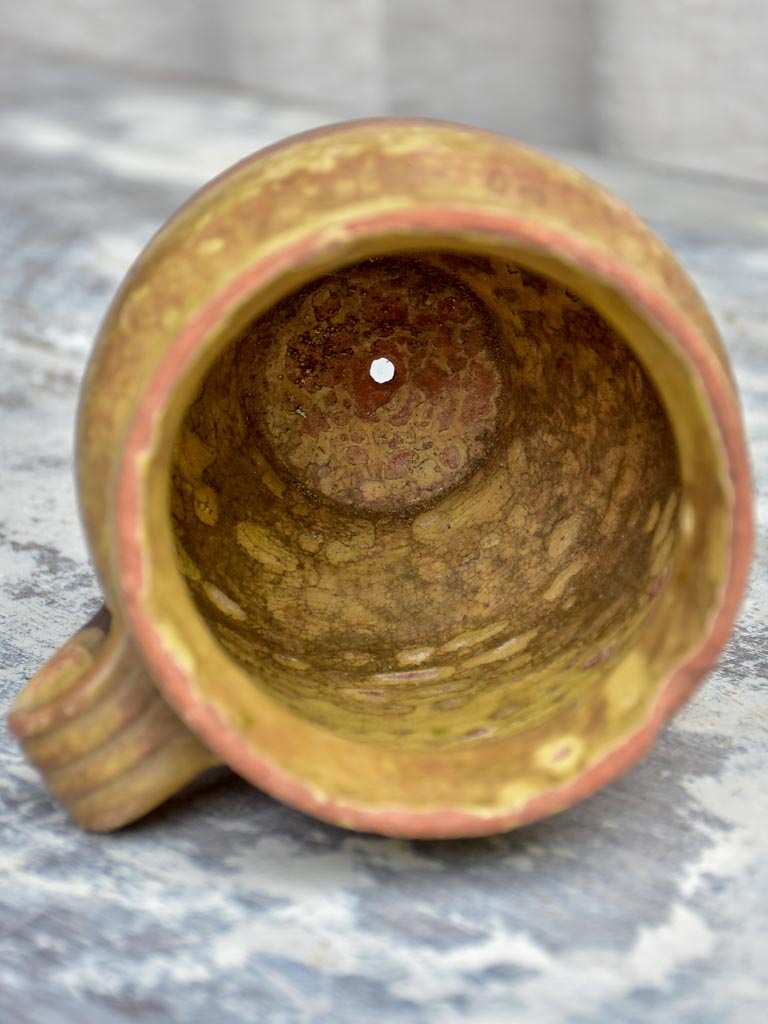 Antique French cup with yellow glaze