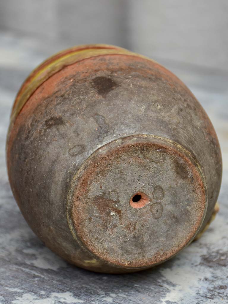 Antique French cup with yellow glaze