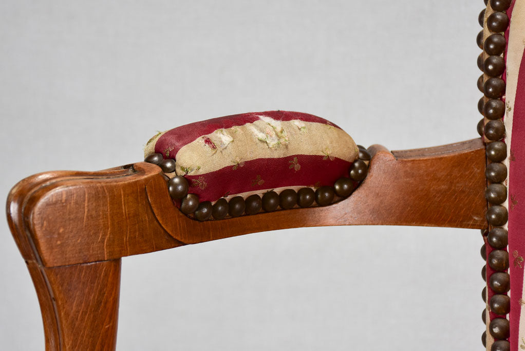 Louis XV-style armchair with red-striped upholstery