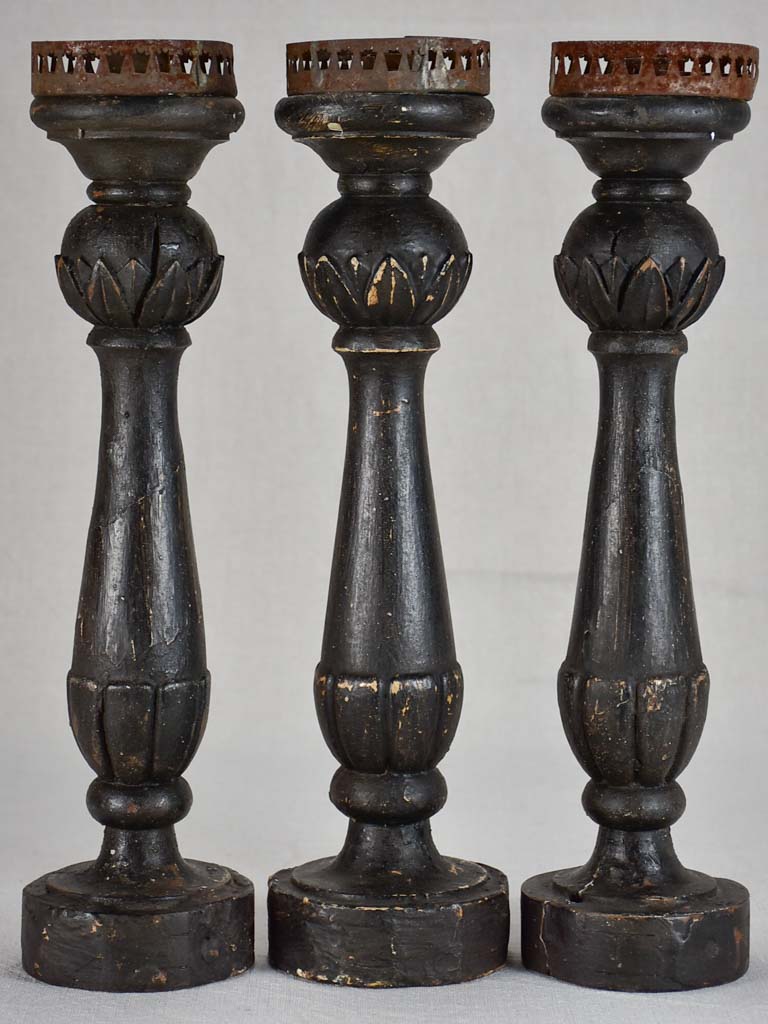 Three twentieth-century French wooden candlesticks with black paint finish 15"