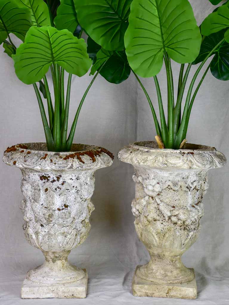 Pair of mid century weathered garden urns with decorative moldings 22"