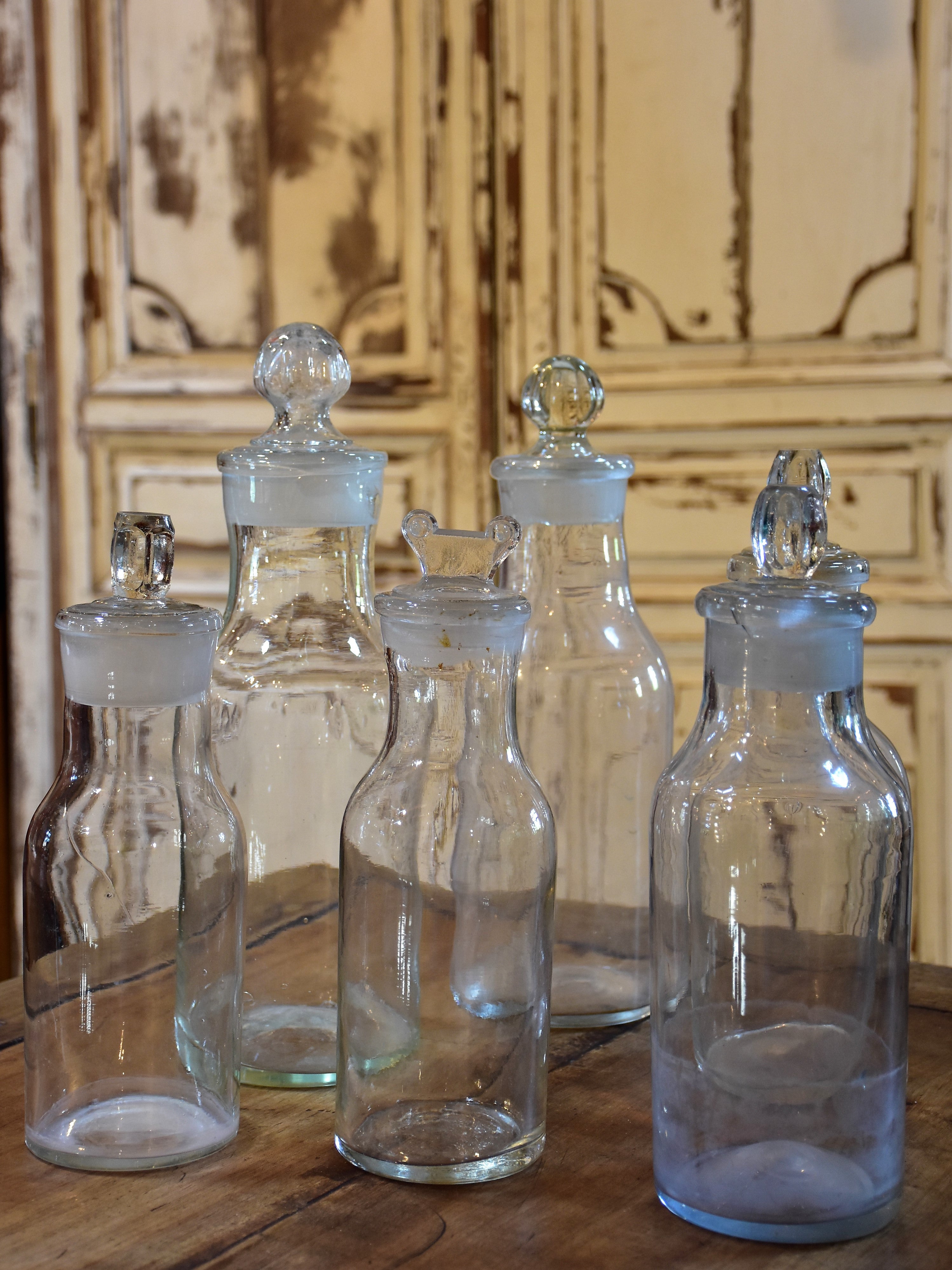 Collection of six antique French bottles with lids