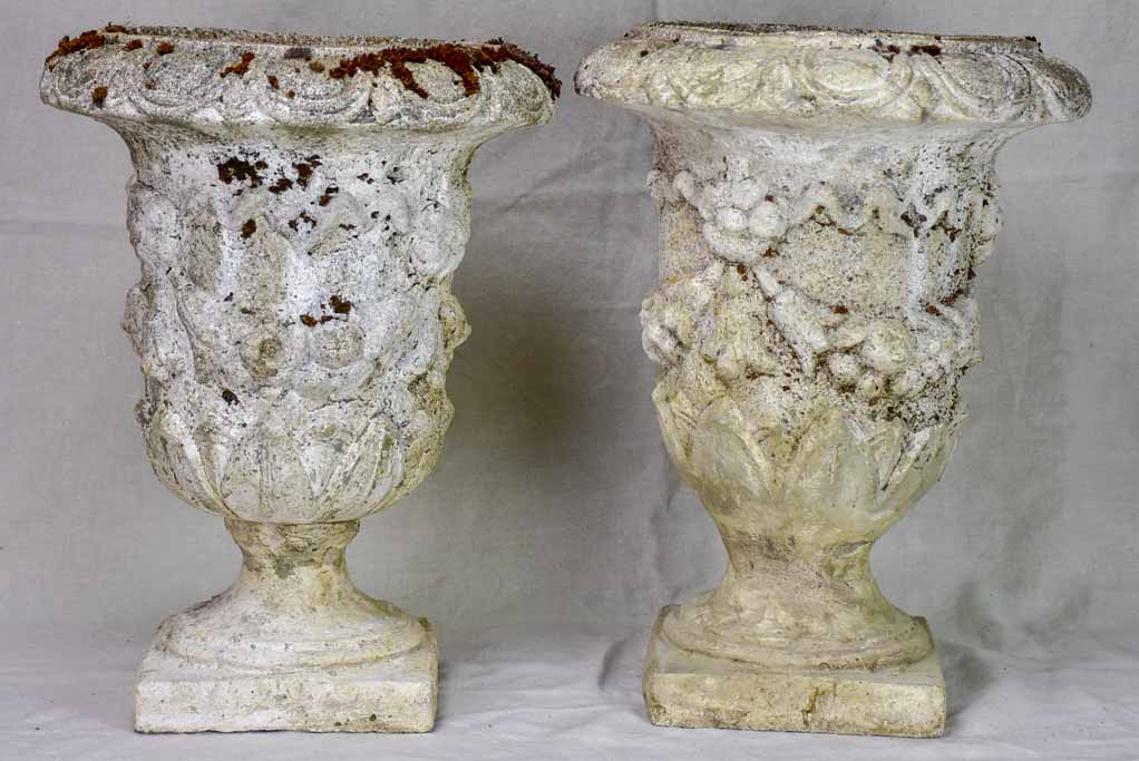 Pair of mid century weathered garden urns with decorative moldings 22"