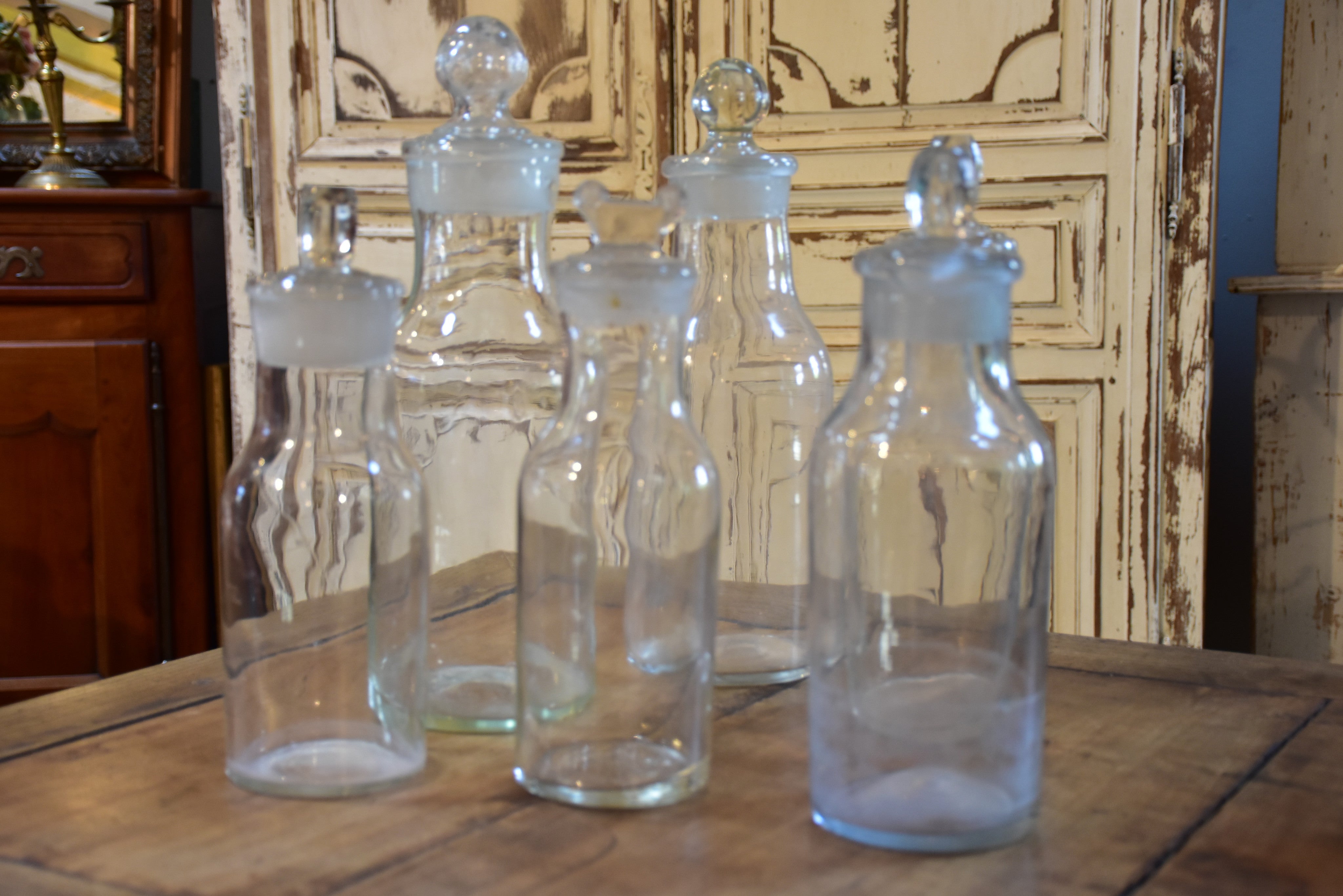 Collection of six antique French bottles with lids