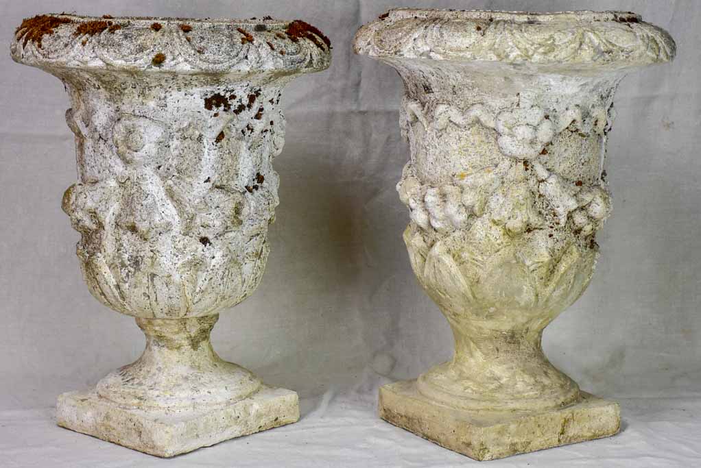 Pair of mid century weathered garden urns with decorative moldings 22"