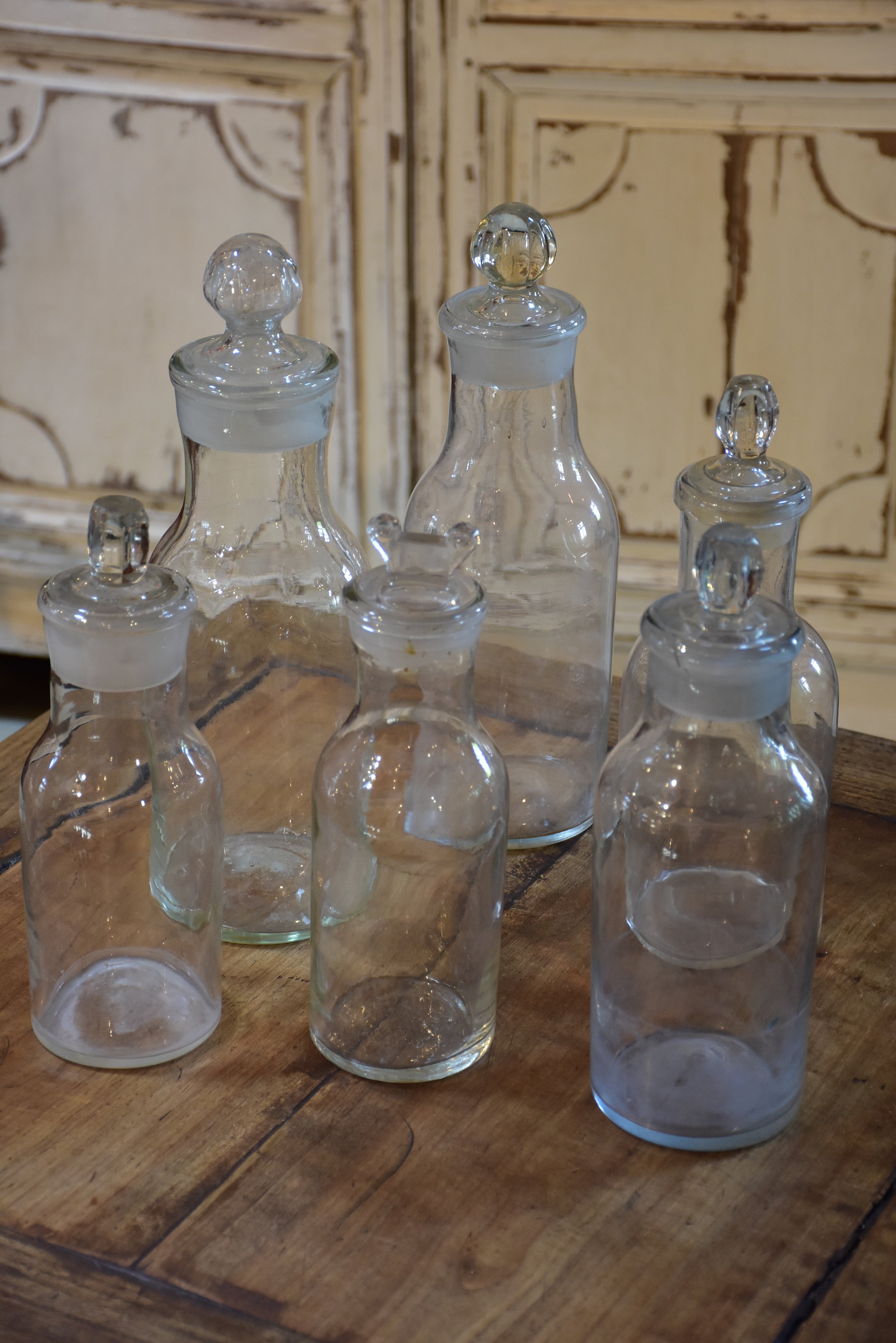 Collection of six antique French bottles with lids