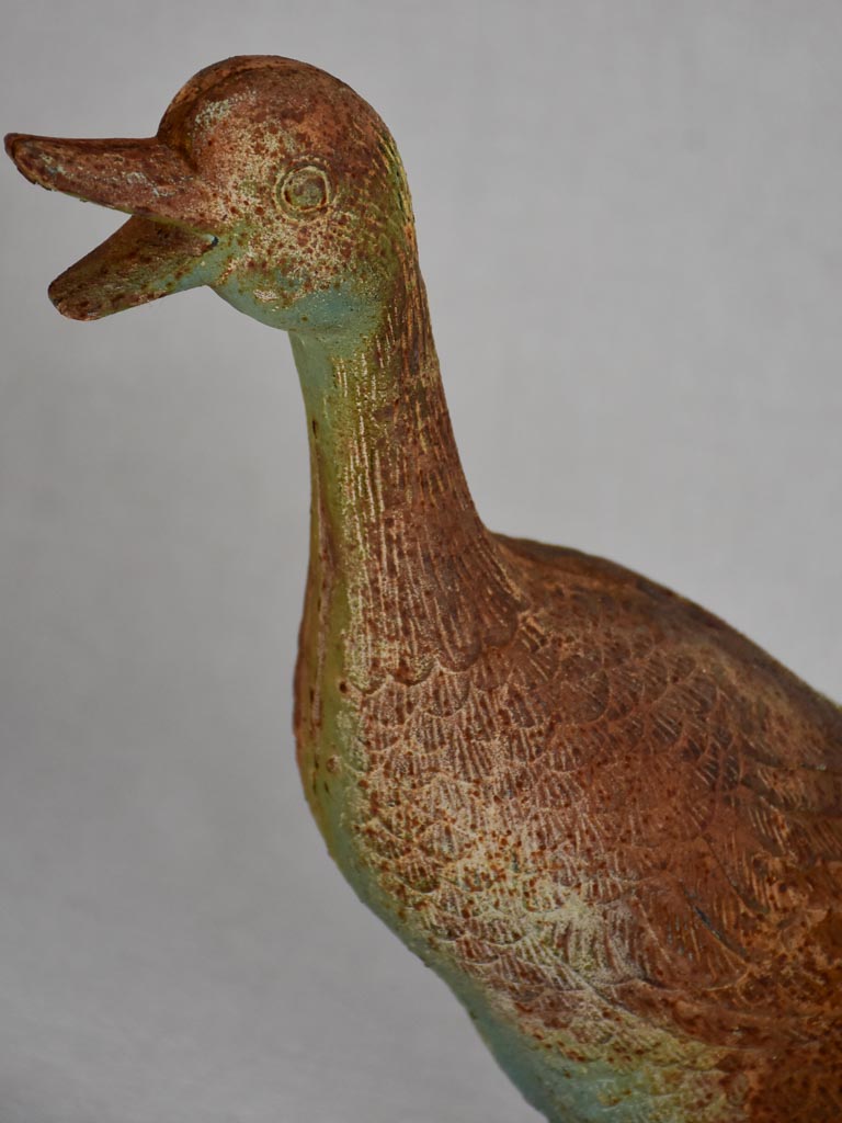 Vintage cast iron duck and oversized snail