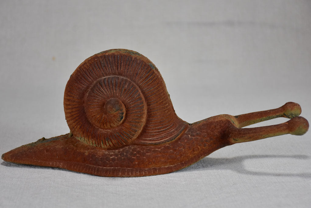 Vintage cast iron duck and oversized snail