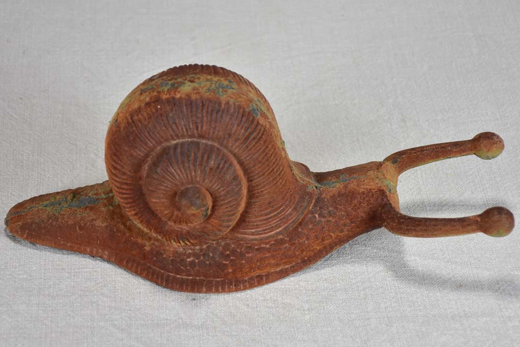 Vintage cast iron duck and oversized snail