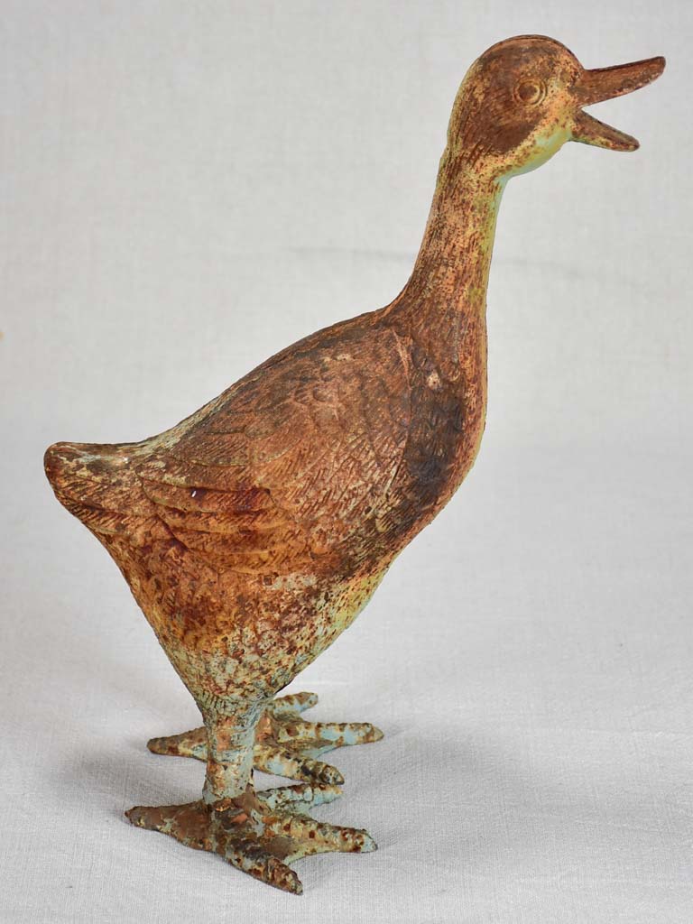 Vintage cast iron duck and oversized snail