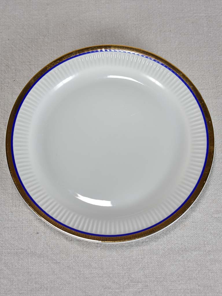 Vintage dinnerware with blue and gold trim