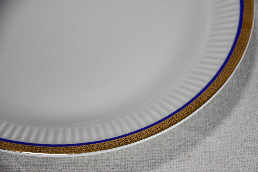 Vintage dinnerware with blue and gold trim