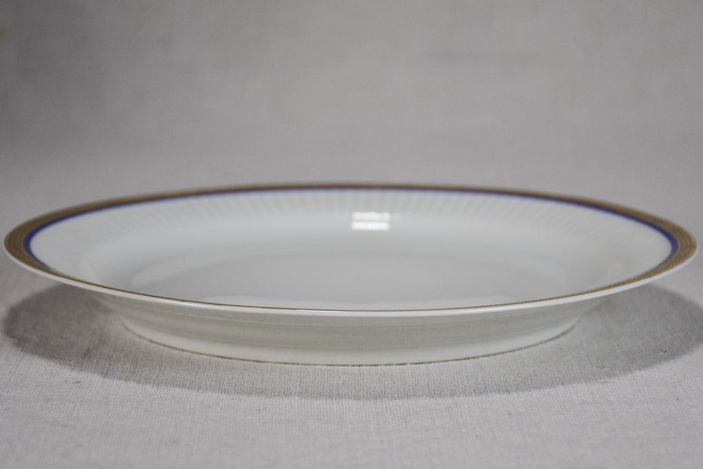 Vintage dinnerware with blue and gold trim