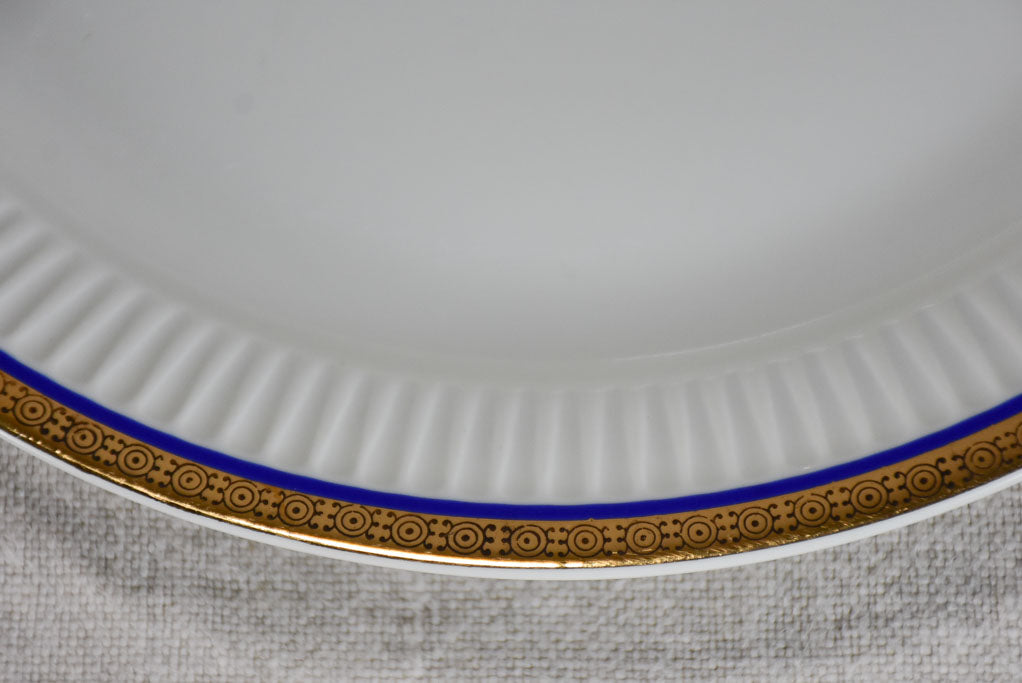 Vintage dinnerware with blue and gold trim