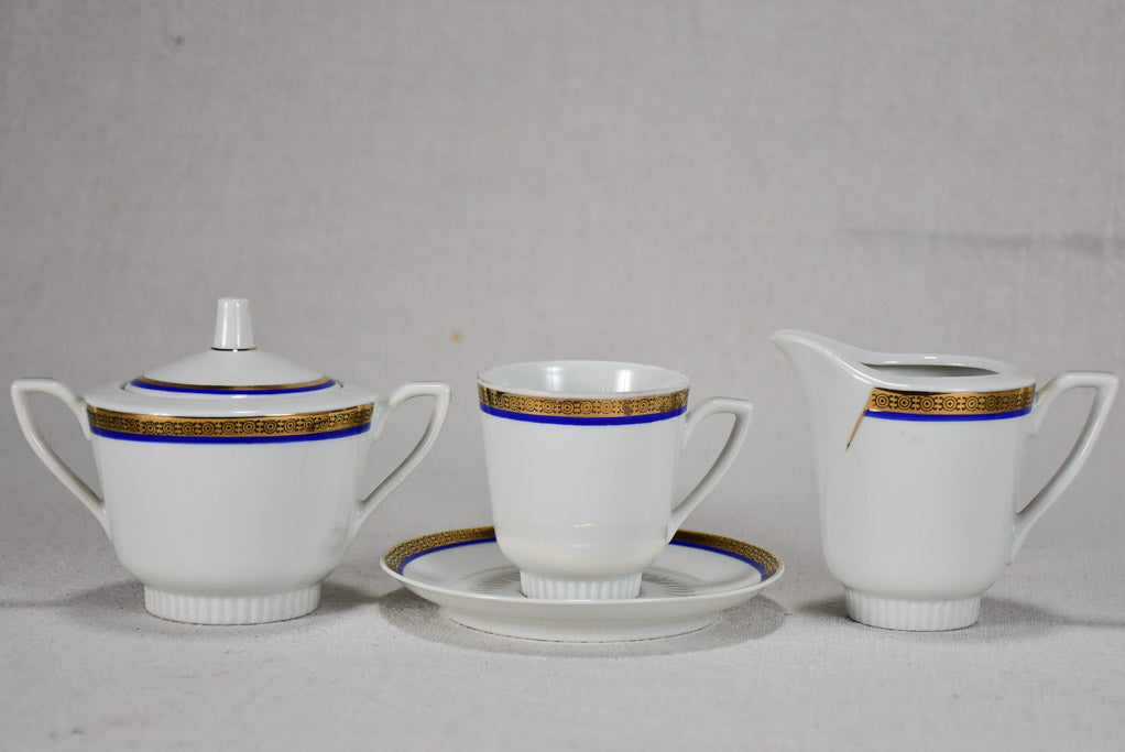 Vintage dinnerware with blue and gold trim