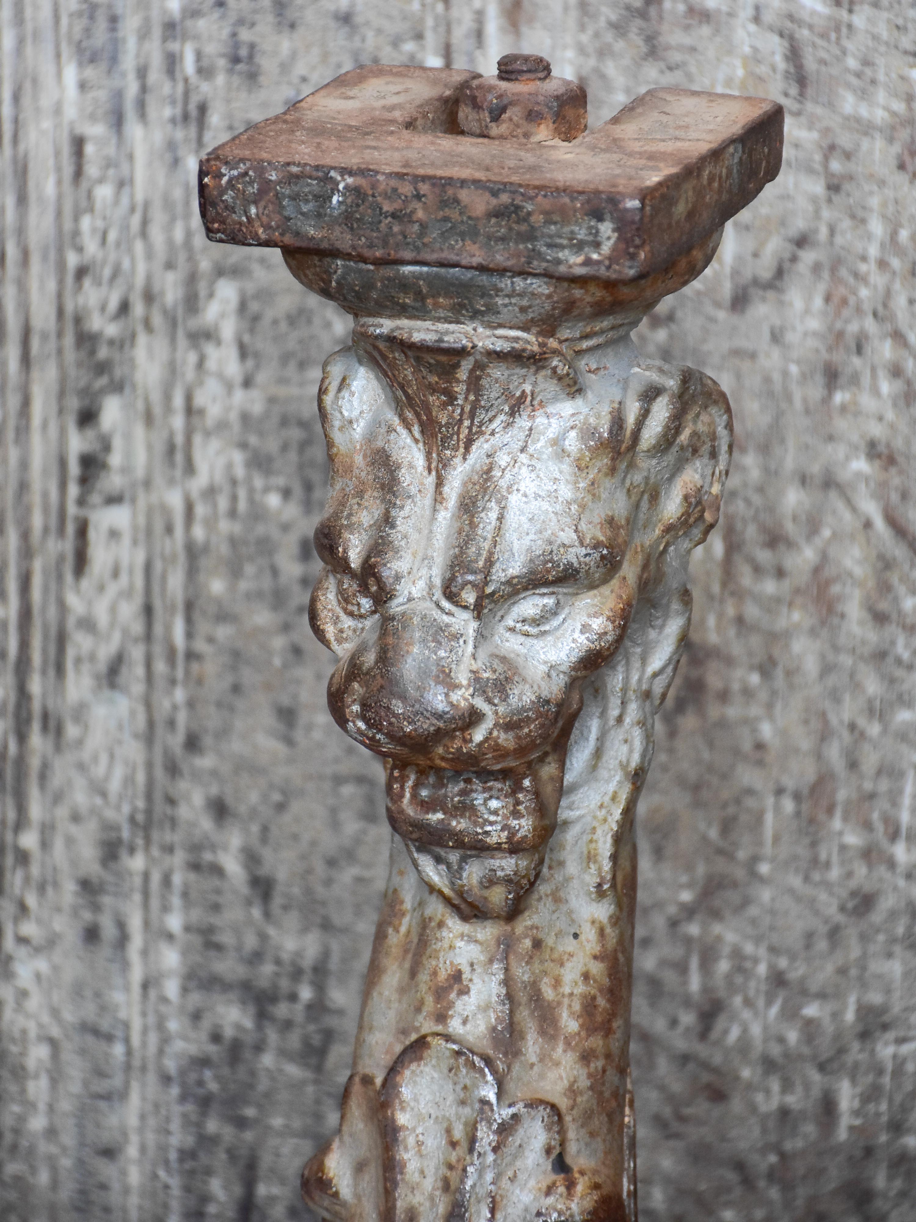 Two console table legs with lion heads and claw feet