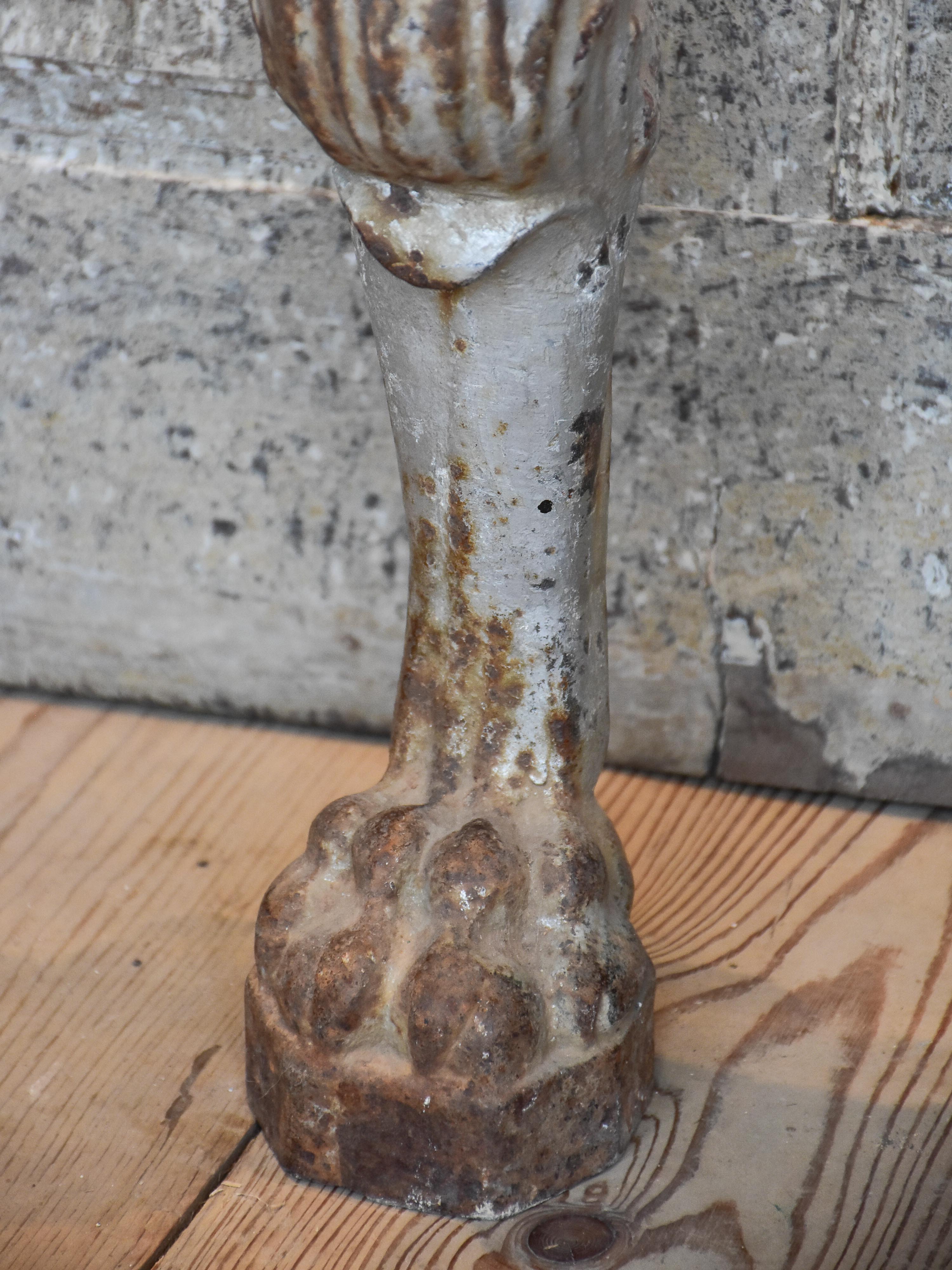 Two console table legs with lion heads and claw feet