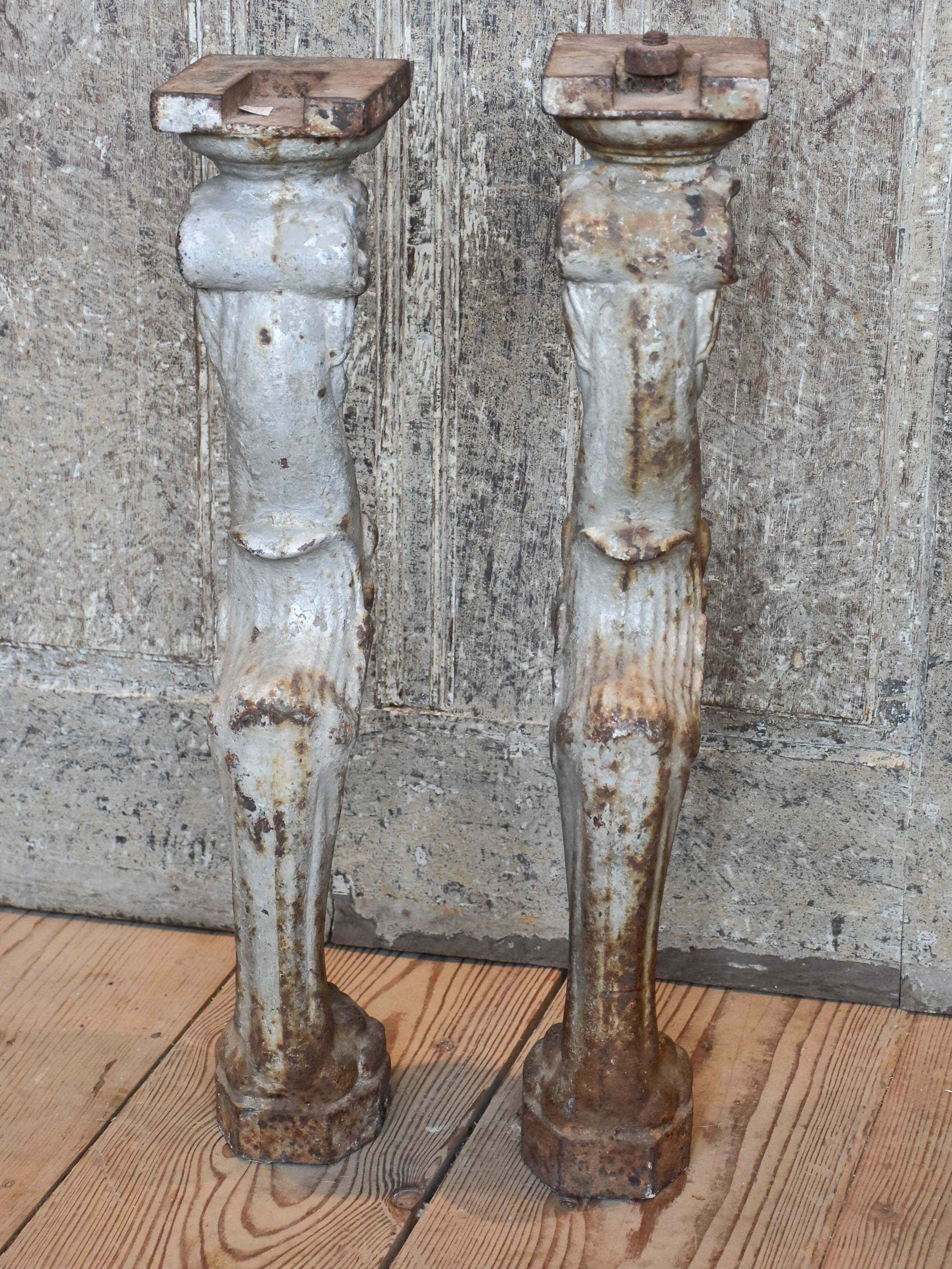 Two console table legs with lion heads and claw feet