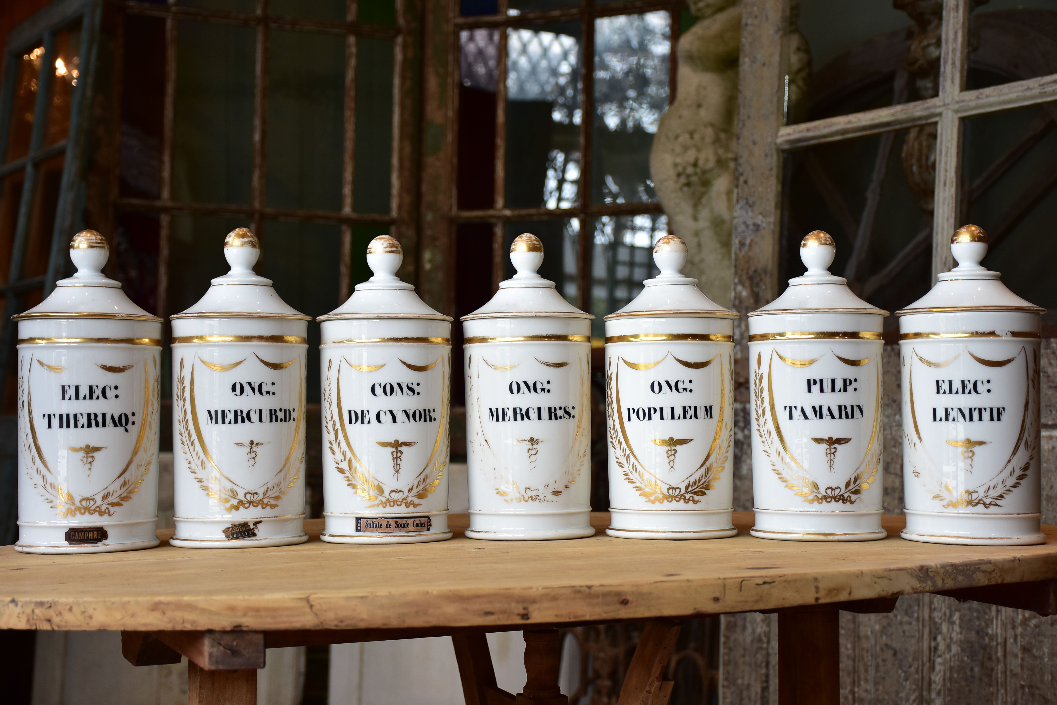 Set of seven French porcelain apothecary jars