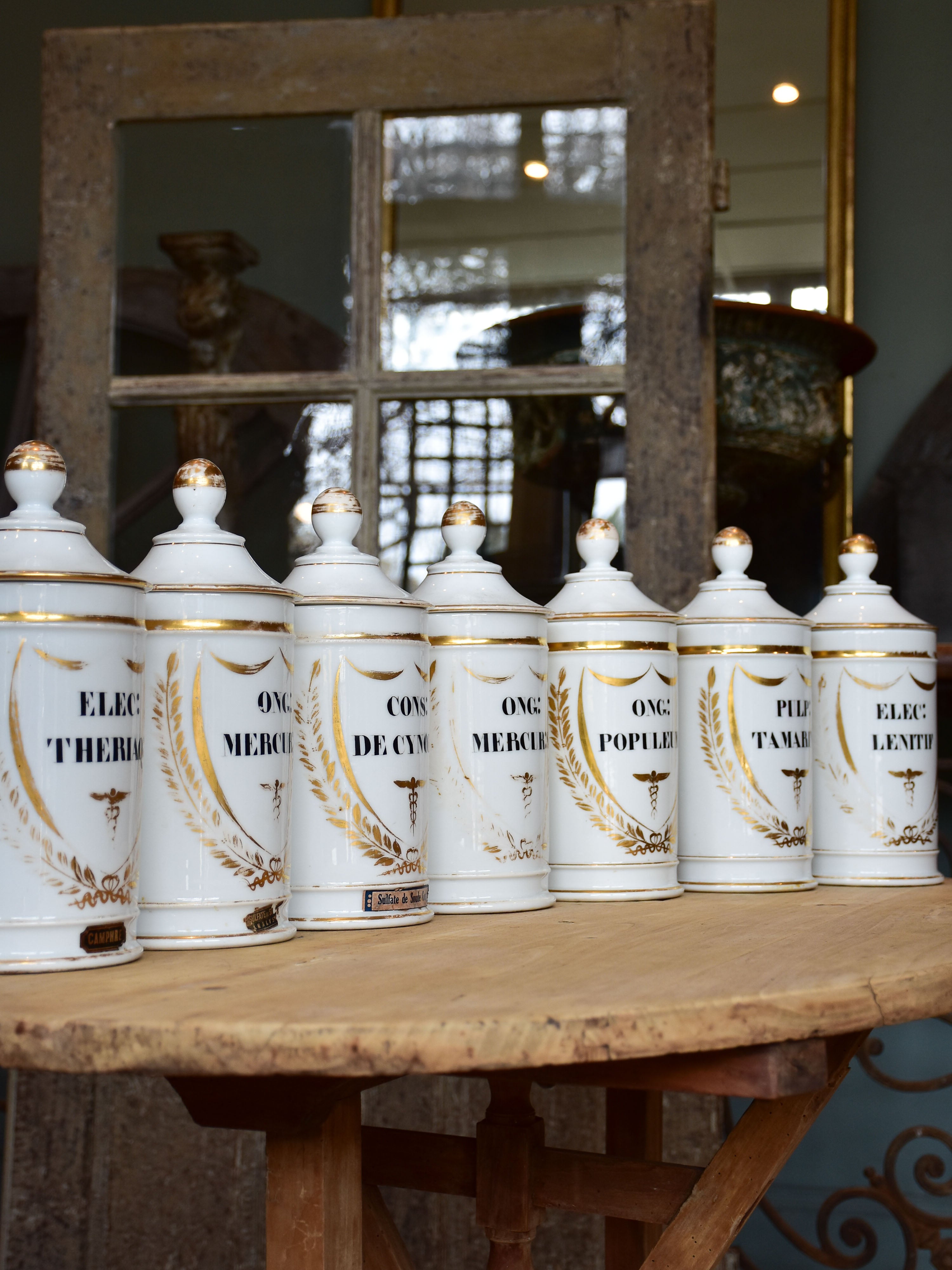 Set of seven French porcelain apothecary jars