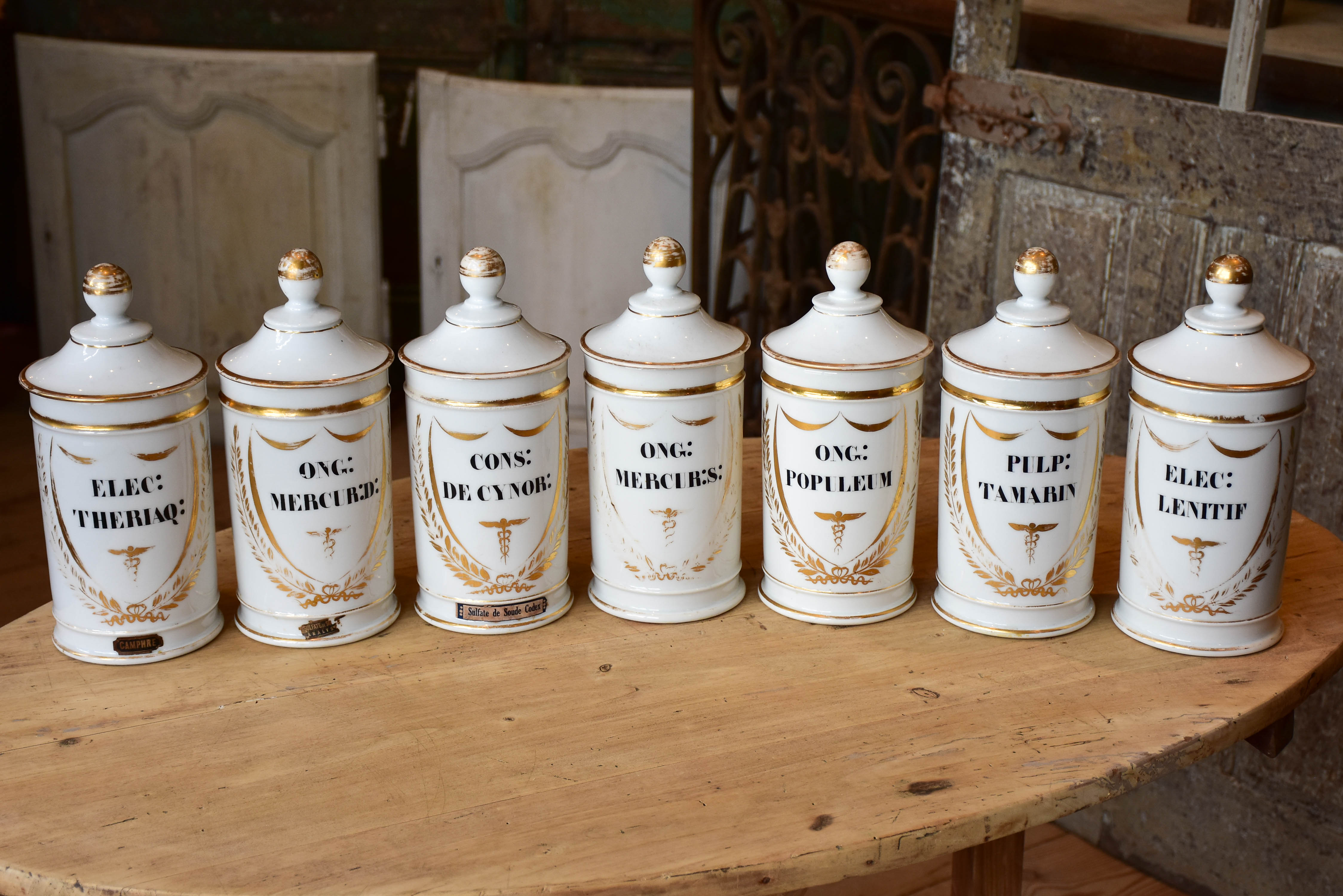 Set of seven French porcelain apothecary jars