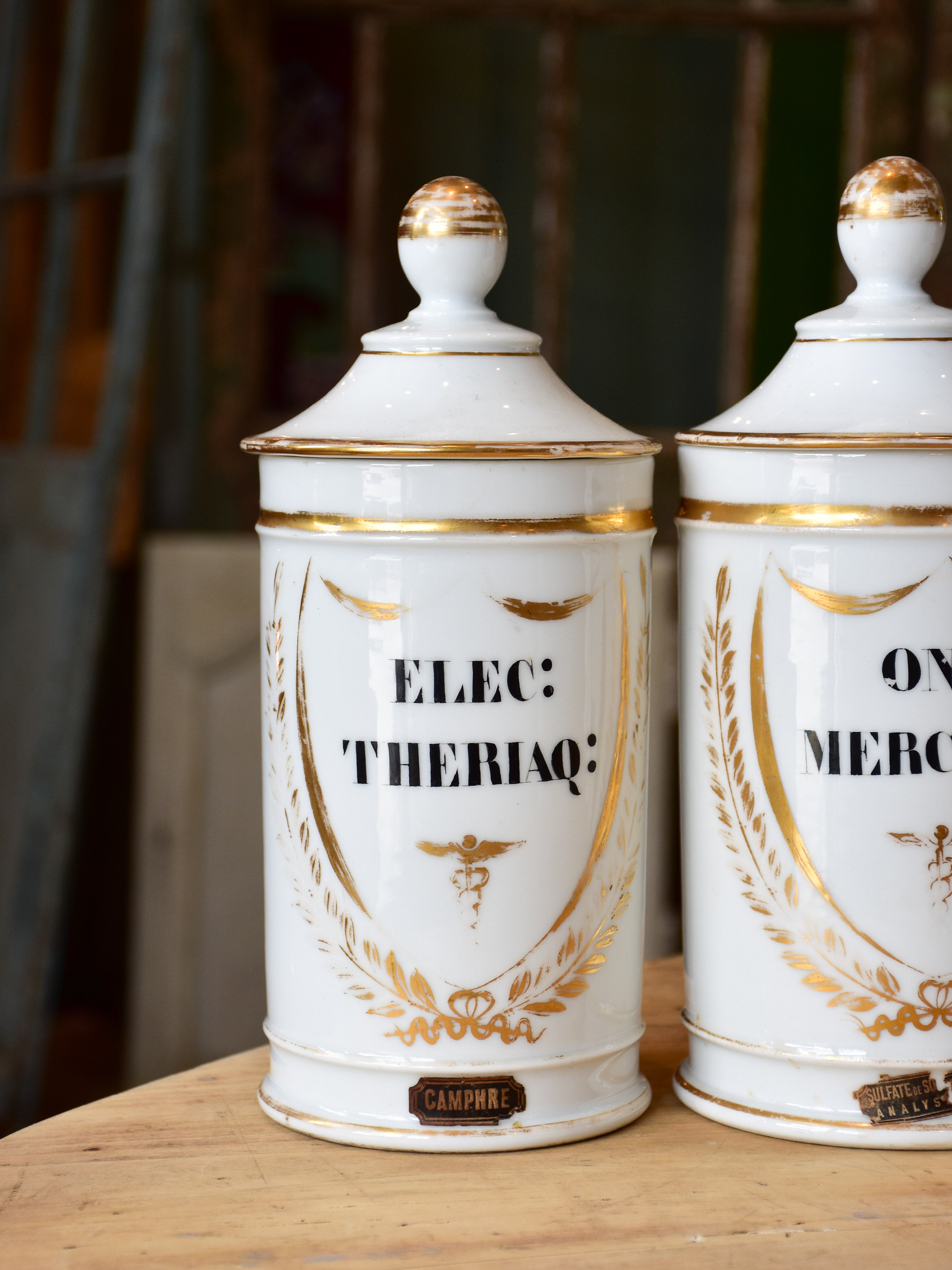 Set of seven French porcelain apothecary jars