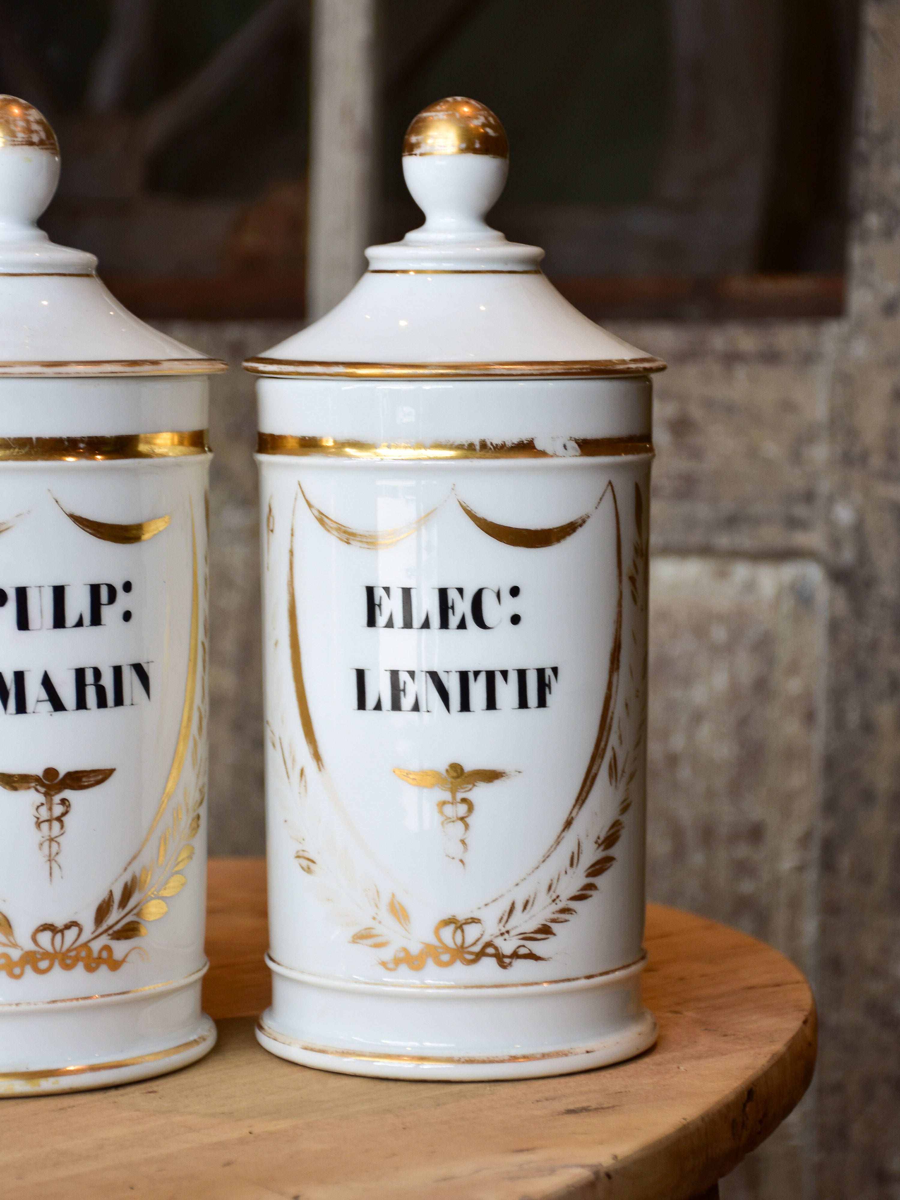 Set of seven French porcelain apothecary jars