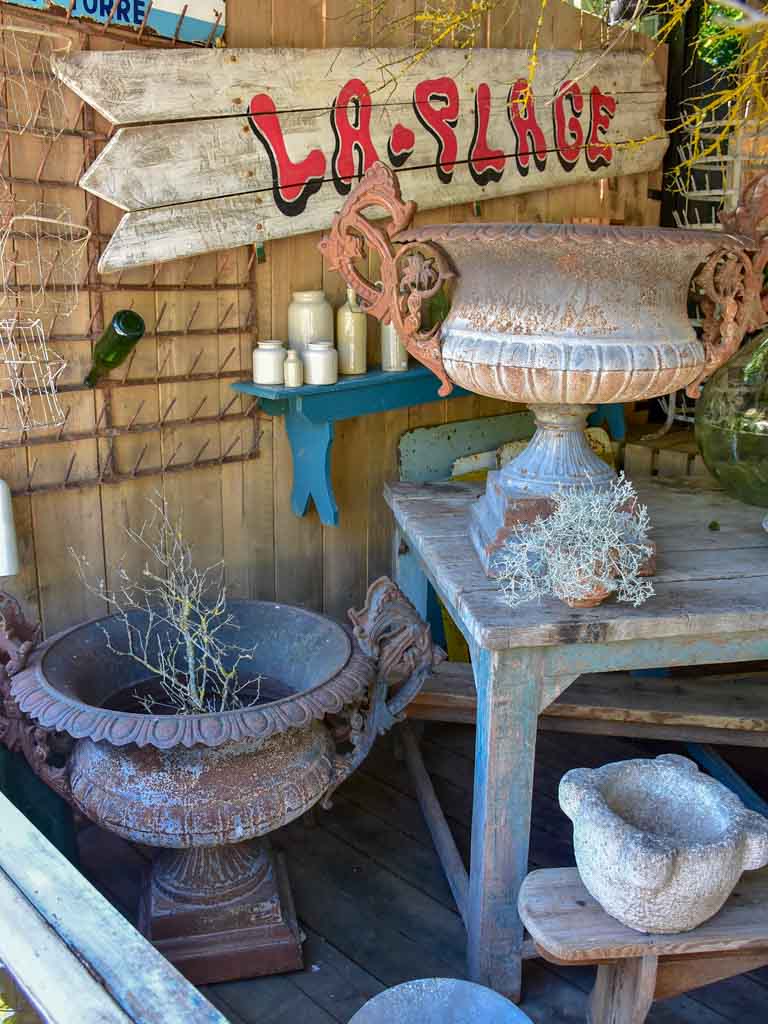 Pair of extra large antique French cast iron Medici urns with overarching handles