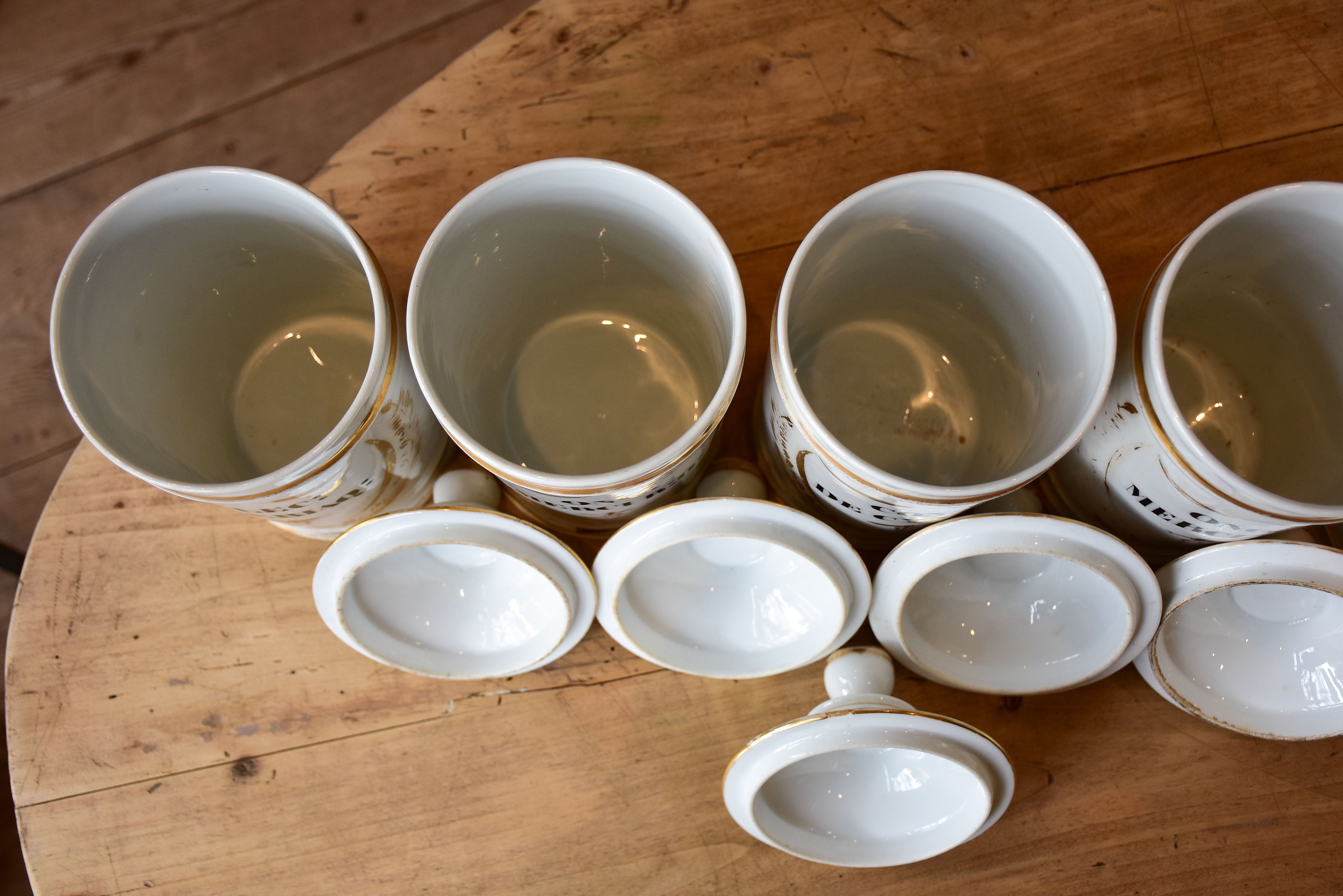 Set of seven French porcelain apothecary jars