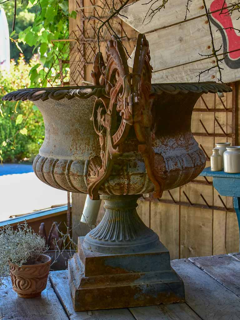 Pair of extra large antique French cast iron Medici urns with overarching handles