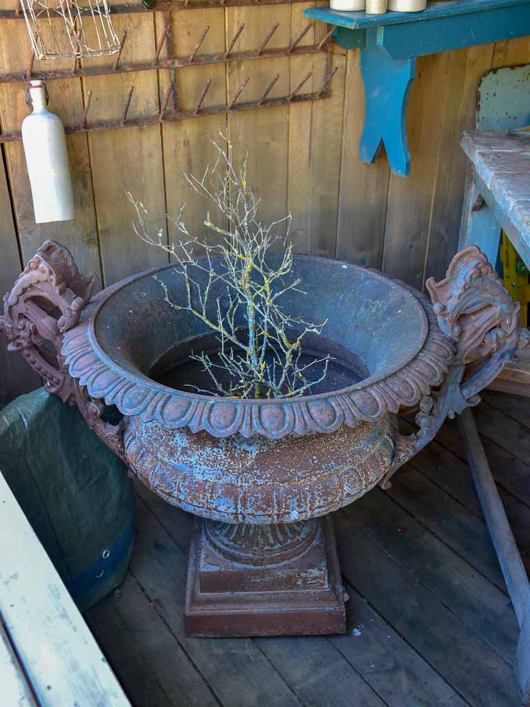 Pair of extra large antique French cast iron Medici urns with overarching handles