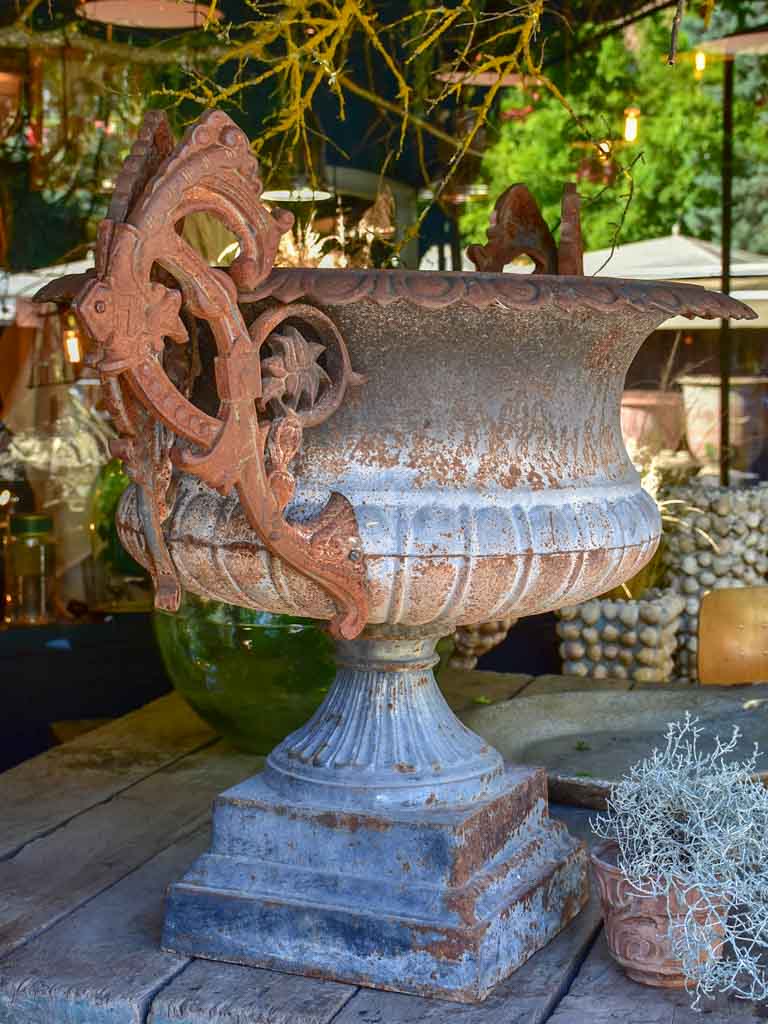 Pair of extra large antique French cast iron Medici urns with overarching handles