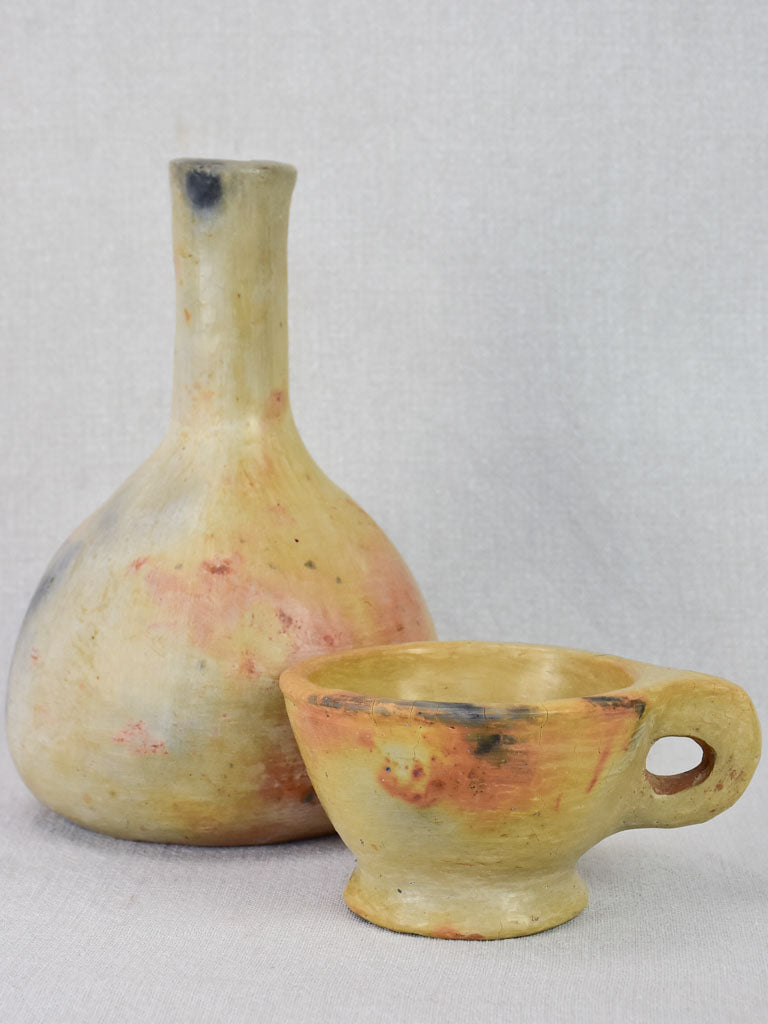 Two artisan-made ceramics made from wood-fired clay - vase and cup