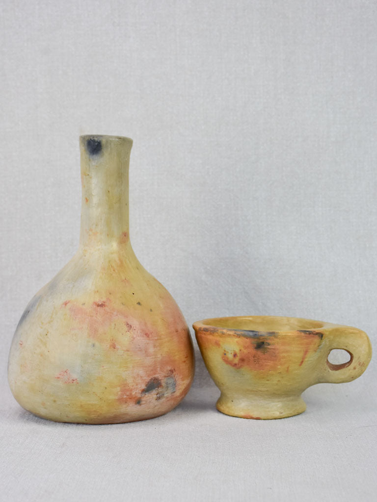 Two artisan-made ceramics made from wood-fired clay - vase and cup