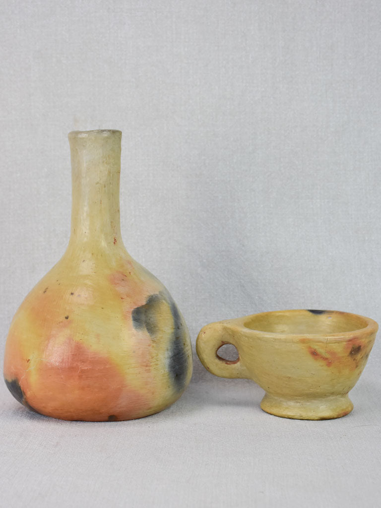 Two artisan-made ceramics made from wood-fired clay - vase and cup