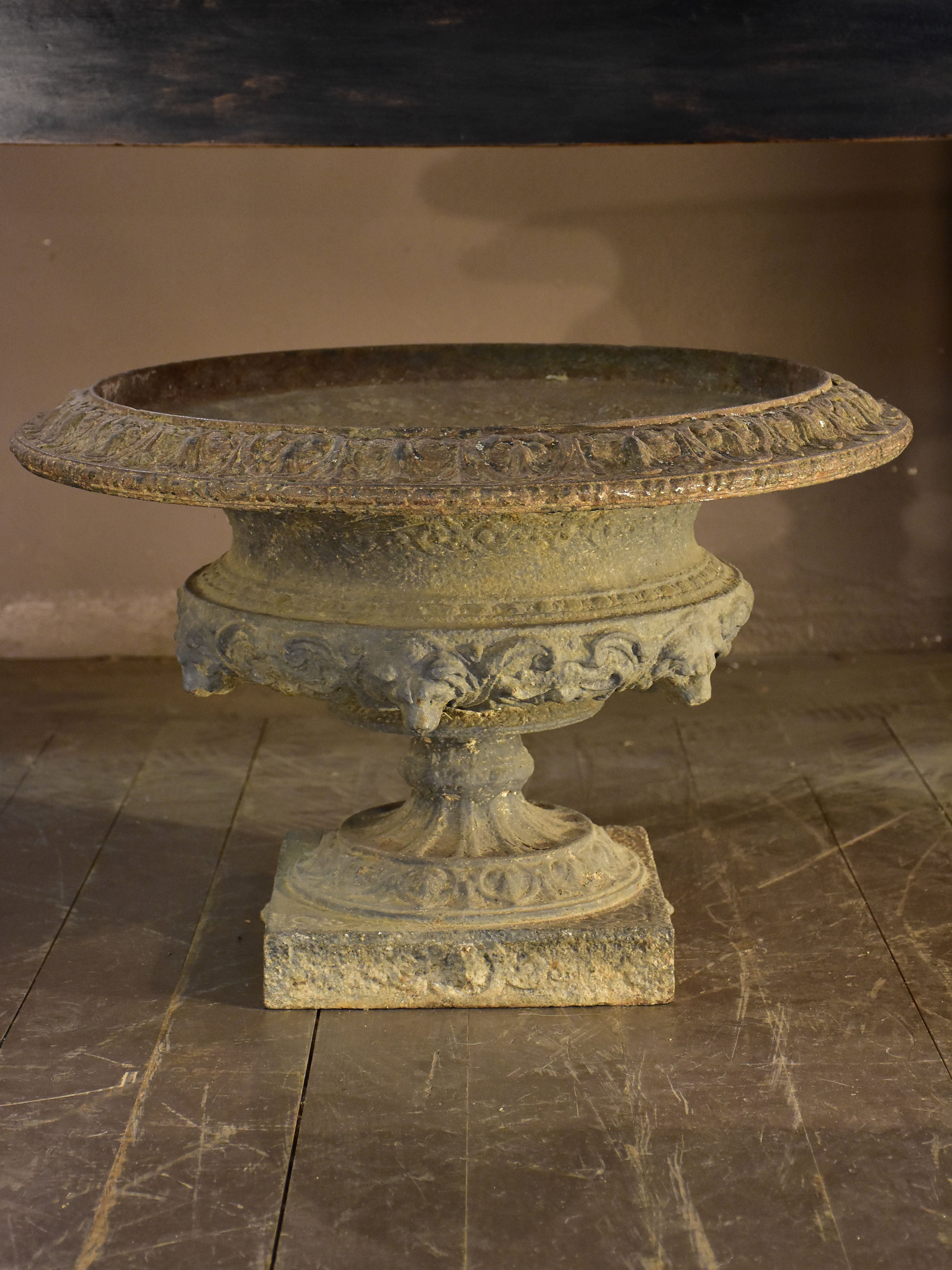 Large grey Medici urn with lions heads