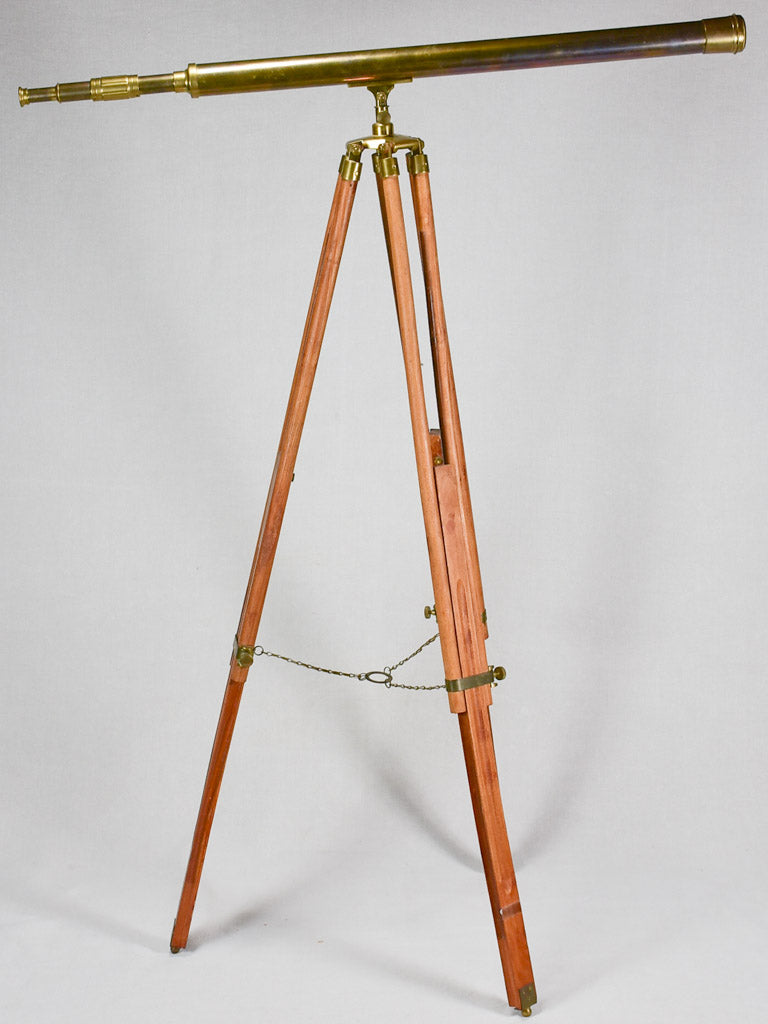 Vintage telescope on wooden tripod