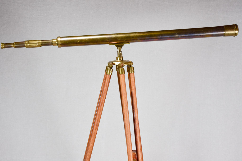 Vintage telescope on wooden tripod